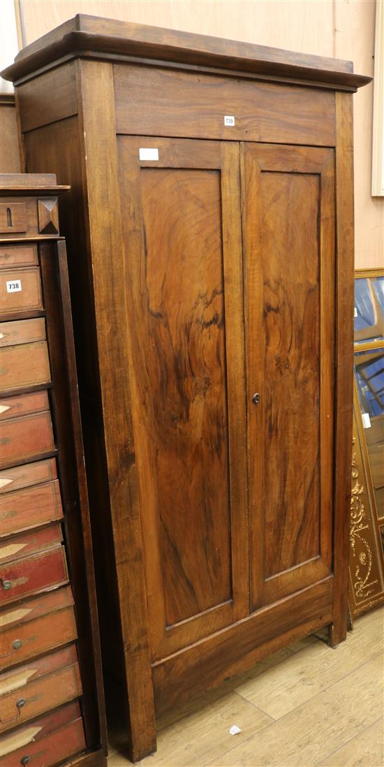 A walnut two door cupboard W.97cm